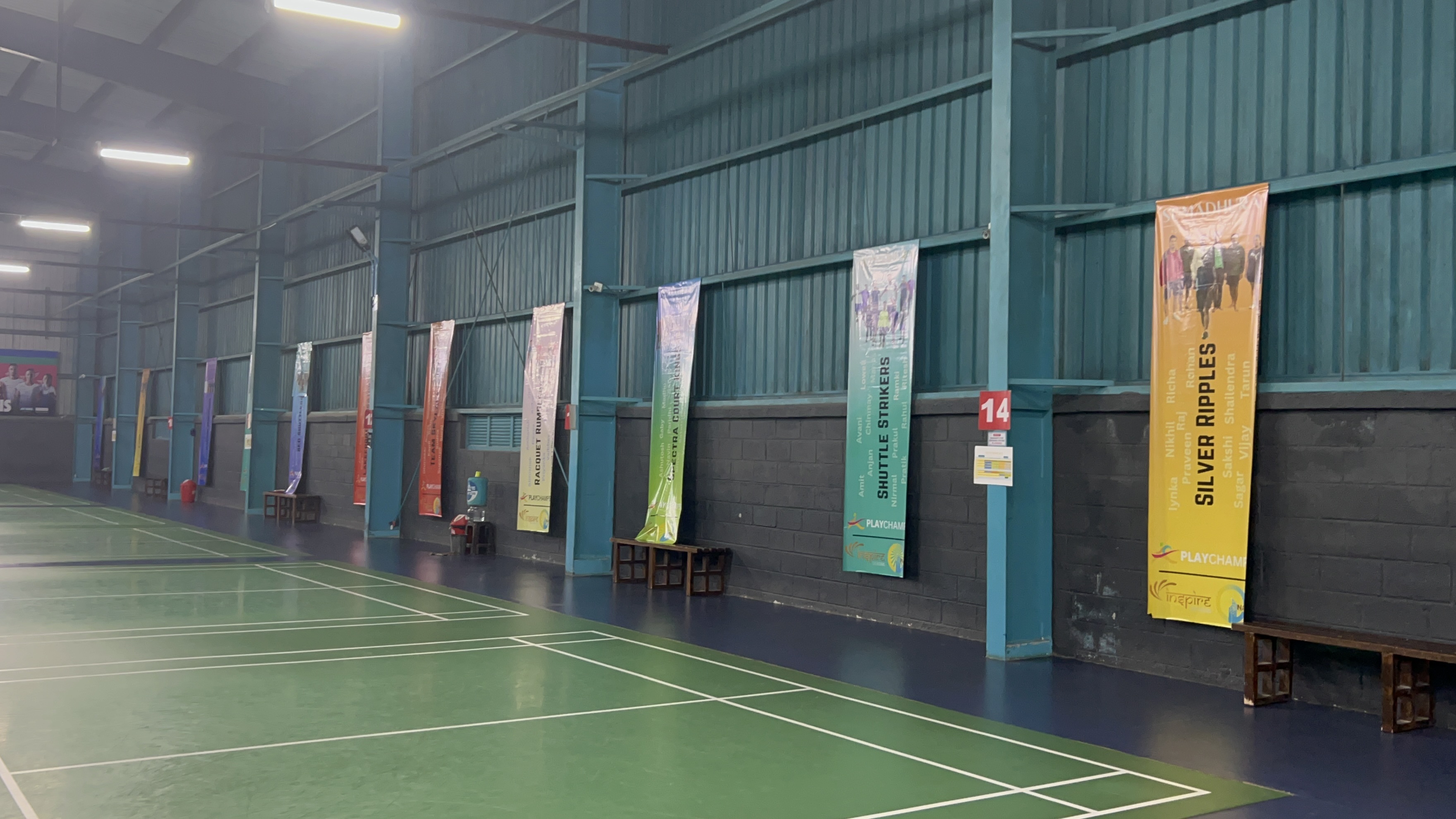 ICBT 2025 - Professional Badminton Courts with Tournament Banners